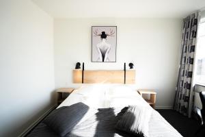 Voodi või voodid majutusasutuse Hotel Medi toas