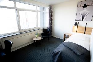 Voodi või voodid majutusasutuse Hotel Medi toas