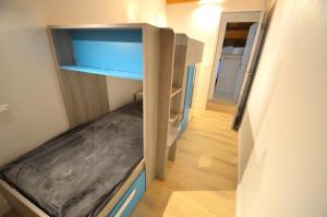 a small room with a bunk bed in it at Chalet Barthelemy - Petit cocon authentique dans les 3 vallées MAE-4204 in Saint-Martin-de-Belleville