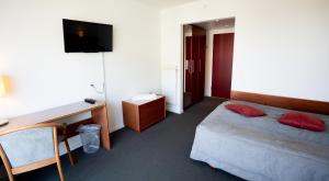 Voodi või voodid majutusasutuse Hotel Medi toas