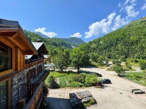 a view of a mountain from a balcony of a house at Chalet Chardons - Chalet Authentique proche des 3 Vallées MAE-3704 in Saint-Martin-de-Belleville
