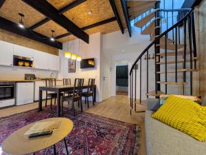 a living room with a table and a dining room at mg4 Apartments in Murau