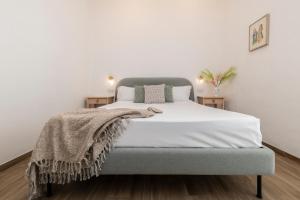 A bed or beds in a room at NG Guest House l'Acquedotto