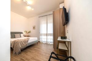 A bed or beds in a room at NG Guest House l'Acquedotto