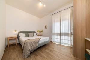 A bed or beds in a room at NG Guest House l'Acquedotto