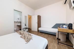 A bed or beds in a room at NG Guest House l'Acquedotto