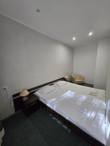 Łóżko lub łóżka w pokoju w obiekcie Artel Villa Tarsis