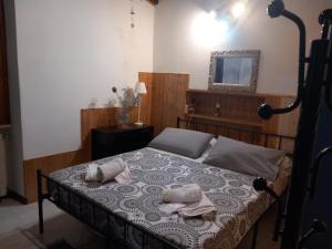 a bedroom with a bed with two towels on it at appartamento in Ponte San Marco