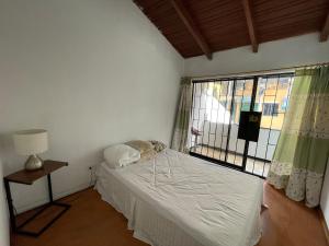 Postel nebo postele na pokoji v ubytování Accommodation in Quito