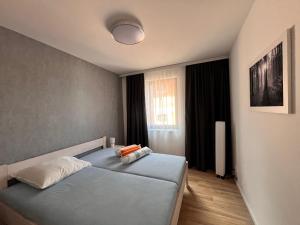 Postel nebo postele na pokoji v ubytování Residence Krušec