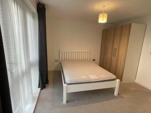 a bedroom with a bed in a room at Private Bedroom in a Shared Penhouse in Gilesgate