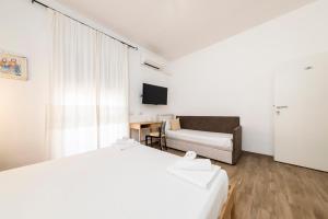A bed or beds in a room at NG Guest House l'Acquedotto