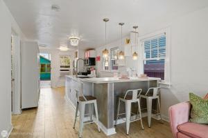 a kitchen with a large island in the middle of a room at The Love Shacks in Lake Worth