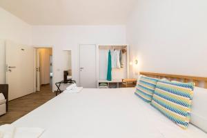 A bed or beds in a room at NG Guest House l'Acquedotto