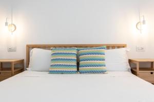 A bed or beds in a room at NG Guest House l'Acquedotto