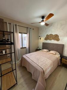 a bedroom with a bed and a ceiling fan at CORNELIAS HOME Estudio 5B in Los Cristianos