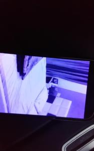 a tv screen with a picture of a person at Caracas orange 2 in Saïdia