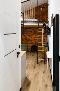 a room with a loft with a bunk bed at Apartament LOFT in Rzeszów +4 photos