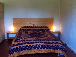 Postel nebo postele na pokoji v ubytování Chalet au coeur d'un parc de 4 ha