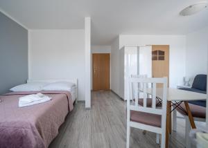 Postel nebo postele na pokoji v ubytování Amber Dom Gościnny