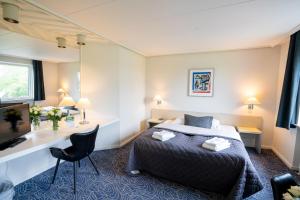 Giường trong phòng chung tại Hotel Norden