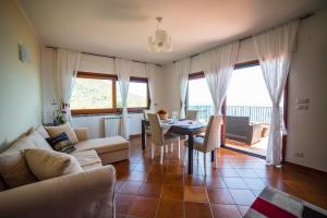 a living room with a couch and a table at Villa Sofia in Taormina