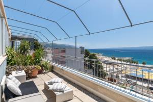 a balcony with a view of the ocean at Split-Luxury apartment Žnjan beach in Split
