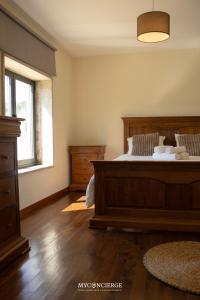 a bedroom with a bed and a window at Casa da Portelinha in Castelo de Paiva +24 photos