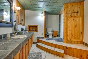 a bathroom with a sink and a toilet at Hot Tub and Private Sauna Wausau Family Home in Wausau +37 photos