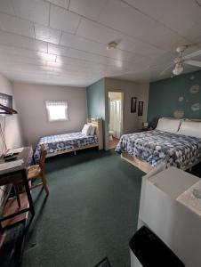 Postel nebo postele na pokoji v ubytování Motel Leblanc