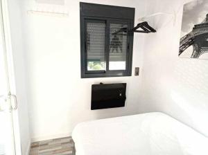 Posteľ alebo postele v izbe v ubytovaní Centro Plaza Torremolinos Piscina Wi-Fi Terraza