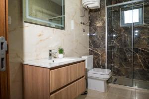 a bathroom with a sink and a toilet and a shower at Robi Apartments in Ulcinj +50 photos