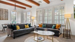 a living room with a couch and a table at LV369 Stylish Upstairs 3BR 3BA LV Condo Near Pool in La Quinta