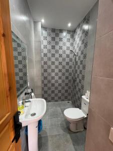 a bathroom with a sink and a toilet at Villa JADE with private pool only family in Marrakech