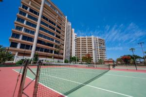 a tennis court in front of a building at Seagulls melody C-209 in Adeje +41 photos