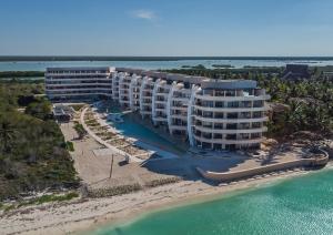 an aerial view of a resort on the beach at Navela 106 Depto vista al mar in Telchac Puerto