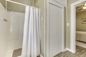 a white shower curtain in a room with a bed at Walk to Restaurants and Shops Dtwn Franklin Retreat in Franklin +17 photos