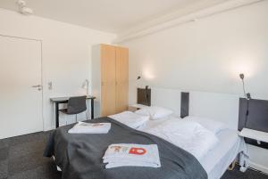Postel nebo postele na pokoji v ubytování Hotel Nørherredhus