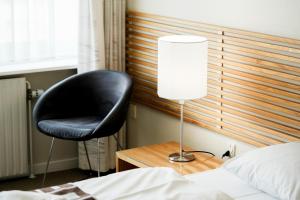Postel nebo postele na pokoji v ubytování Hotel Nørherredhus