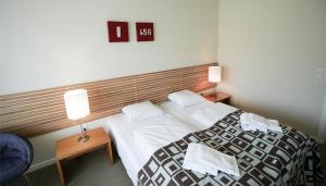 Postel nebo postele na pokoji v ubytování Hotel Nørherredhus