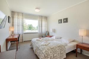 Postel nebo postele na pokoji v ubytování Hotel Nørherredhus