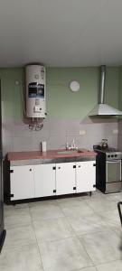 Kuchyň nebo kuchyňský kout v ubytování Complejo Corrientes Dpto 5