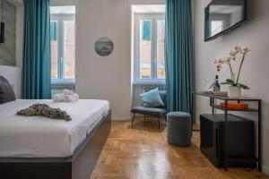A bed or beds in a room at The Venue Spagna