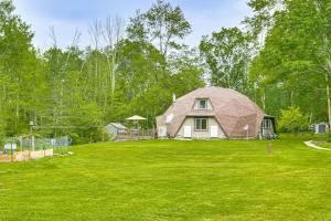 a house with a gambrel roof on a green lawn at Dome Escape in Nature with Deck 3 Mi to Kent Falls in Warren