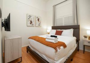 a bedroom with a large bed with a television on it at Stylish & Sunny With Heated Pool In The Foothills! in Phoenix
