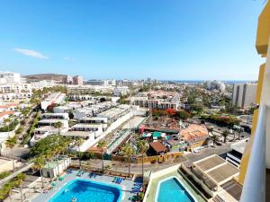 a view of the city from the balcony of a building at Panoramic & Sea View Holiday Home in Playa de las Américas, Tenerife South in Playa de las Americas