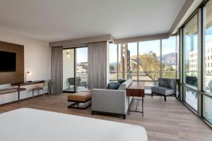 a hotel room with a view of a living room at AC Hotel Pasadena in Pasadena
