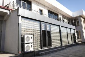 a building with a fan on the side of it at City hostel in Termiz