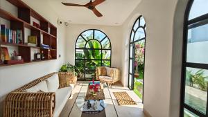 a living room with a couch and a table at The White House in Tuy Hoa