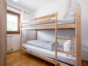 A bed or beds in a room at Fleckalm